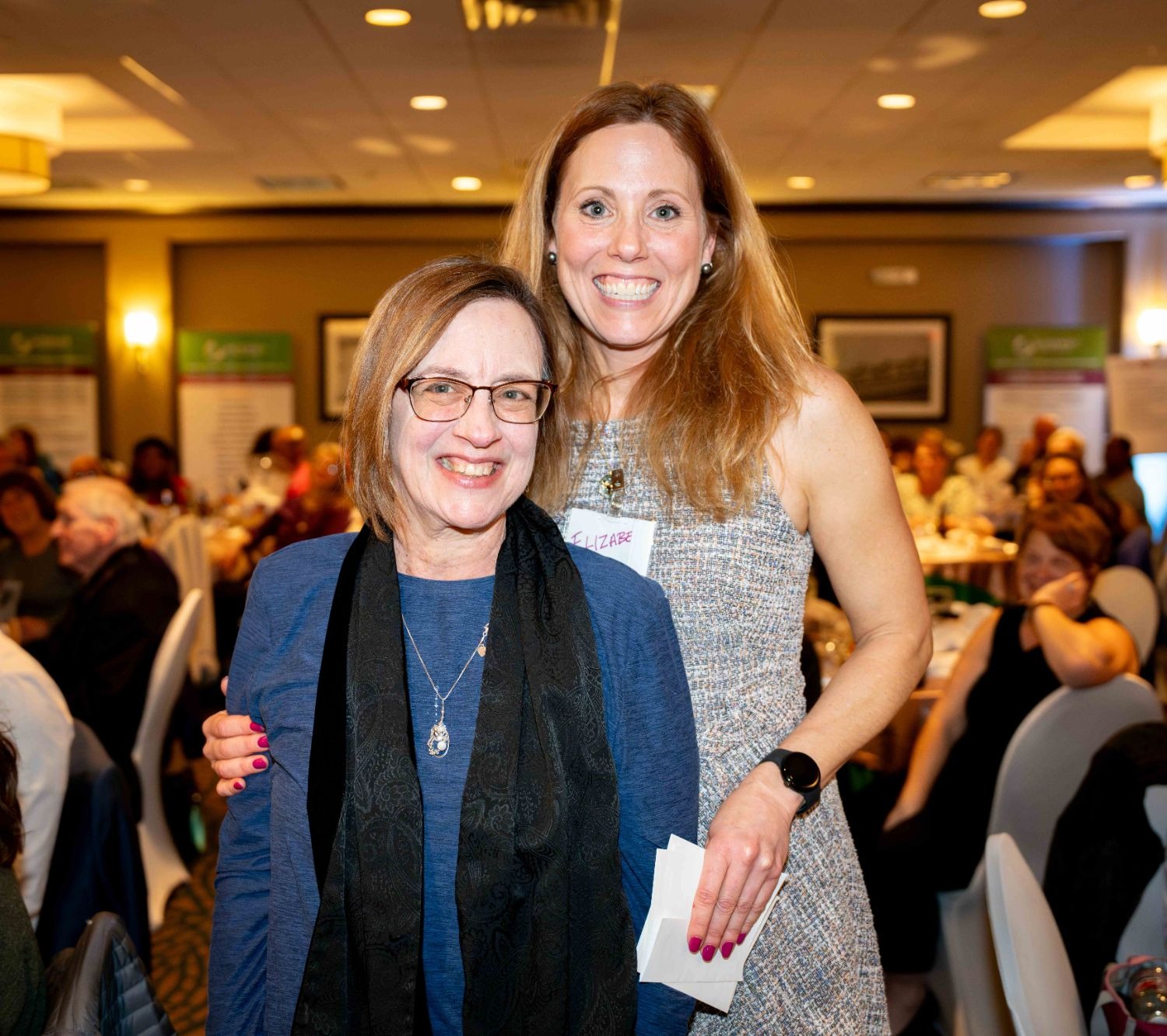 Two women smiling