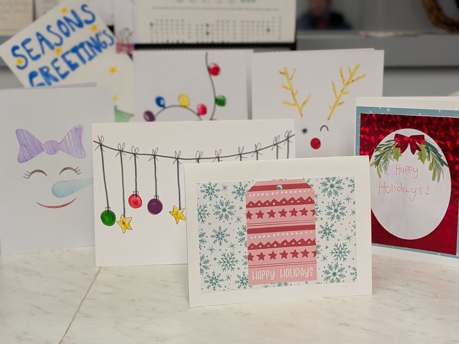 a collection of homemade holiday cards